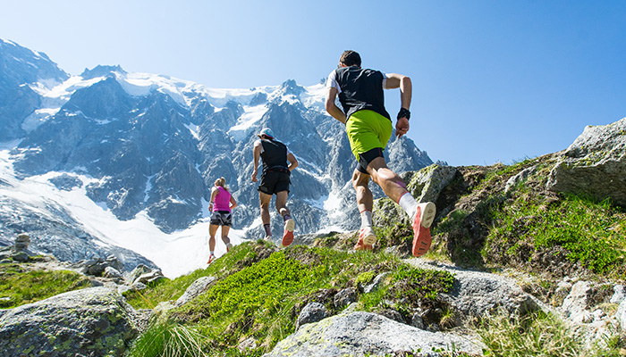 Joggers-running-across-mountain-range