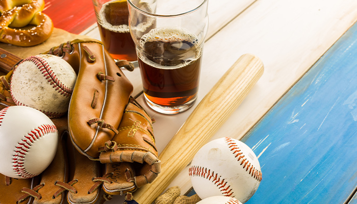​​​A beer bottle next to a baseball