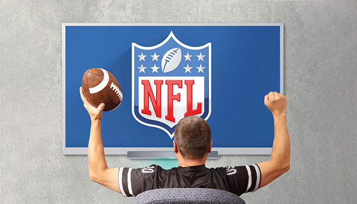 NLF fan in front of TV screen