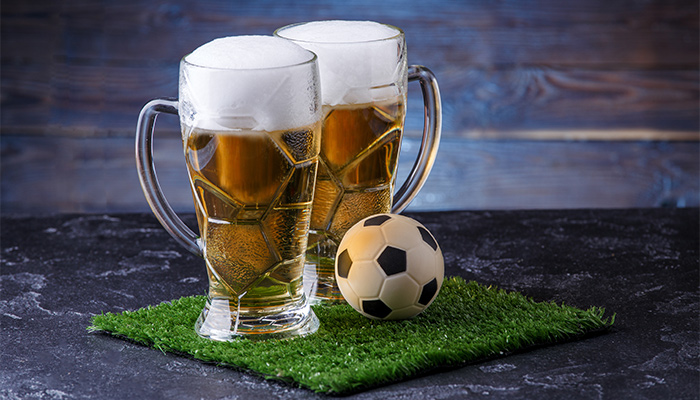 ​soccer ball next to beer