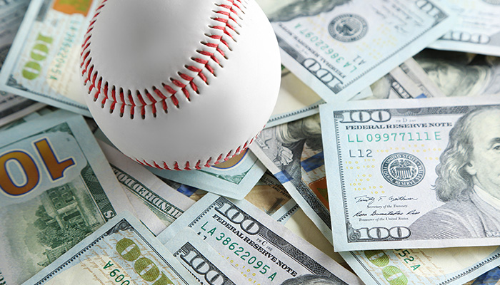 А baseball on dollar bills