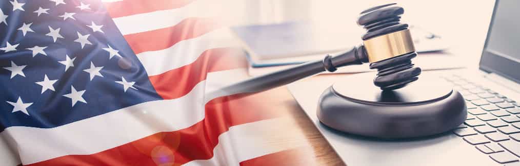 Flag of the United States of America, laptop, and judge's gavel