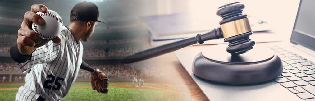 Baseball Player Throwing a Ball Next to a Gavel on a Computer