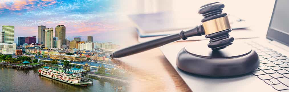 Cityscape of New Orleans, Judges gavel and block with a laptop placed on a desk