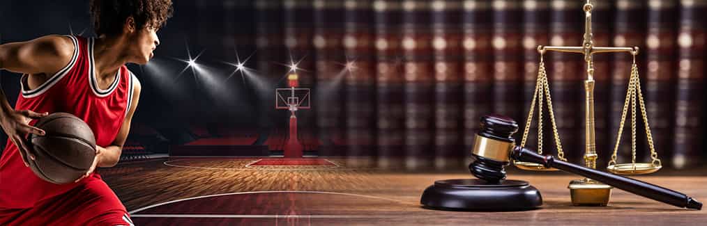 Basketball player in a court, law books, judges gavel and block, and Scales of Justice
