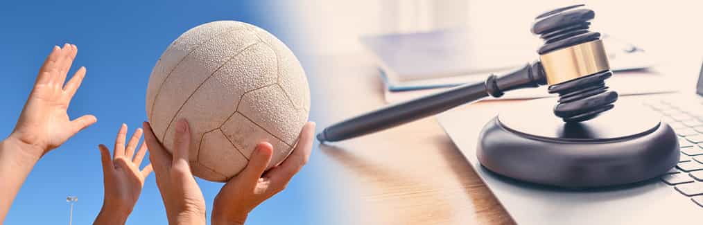 netball players and ball, laptop, judges gavel and block