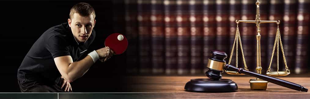 Table tennis player, law books on shelf, and statue of Scales of Justice