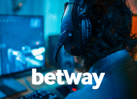 Betway logo and close up rear shot of man playing game on desktop computer