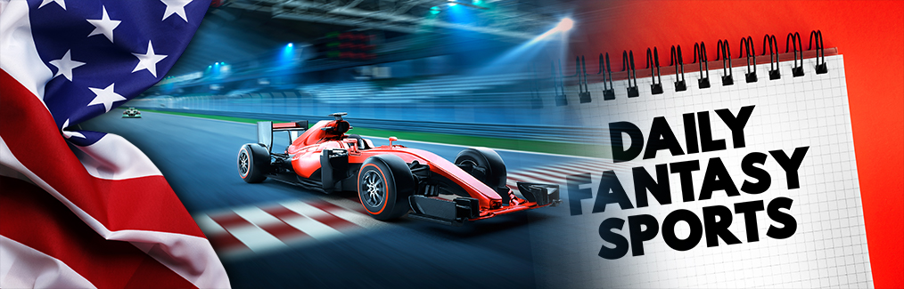 American flag, F1 car driving on track, and a note pad