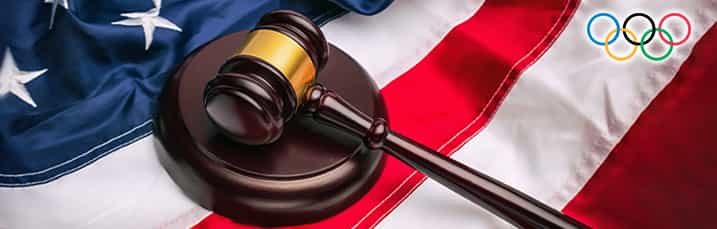 Flag of the United States of America, judges gavel and block, and the Olympic rings