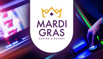 Mardi Gras Logo in front of a Slot Machine