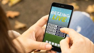 Player Browsing Through a Mobile Sports Betting Site on a Phone
