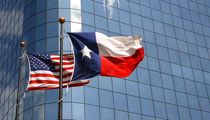 The USA and Texas Flags on Poles