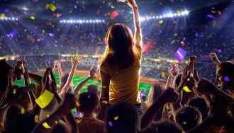 An image showing a soccer stadium and celebrational fireworks