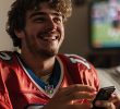 Gambler Using Smartphone to Bet on Football