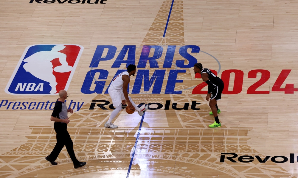A recent NBA game played in Paris with two players facing off.