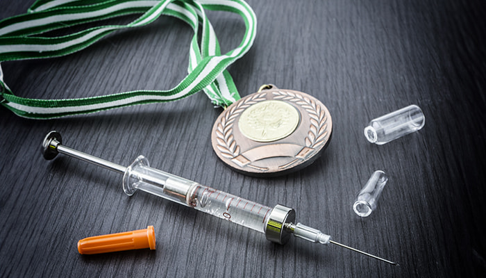 Medal and syringe
