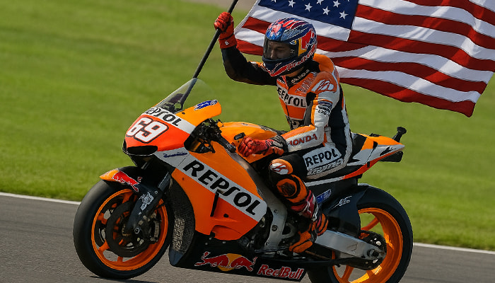 MotoGP rider on a bike with the American flag
