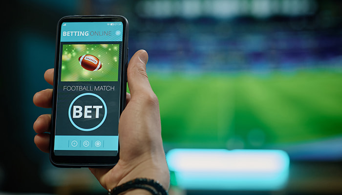 Man placing a bet on mobile