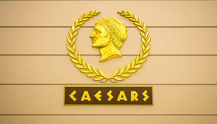 The Caesars logo on a wall