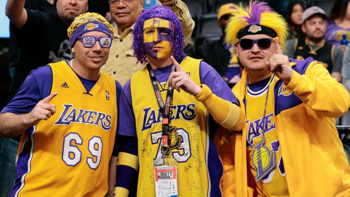 Lakers fans posing for a photo.