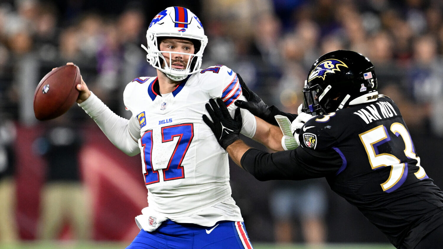 Josh Allen faces a defender.