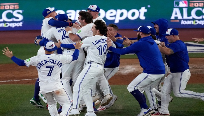 The Toronto Blue Jays celebrate after Game 7 of baseball's American League Championship Series against the Seattle Mariners, Monday, Oct. 20, 2025, in Toronto.